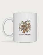 Koala book mug with a vintage storybook koala in round spectacles reading a book in a gum tree above Koala-fied Reader lettering, on a white ceramic mug