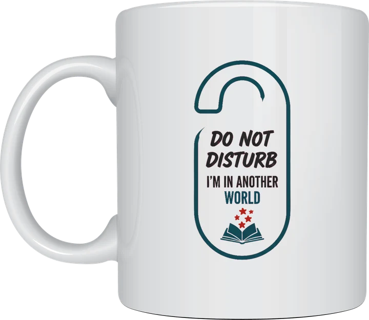 Funny reading mug with a door hanger sign design reading Do Not Disturb, I'm In Another World with a small open book, on a white ceramic mug