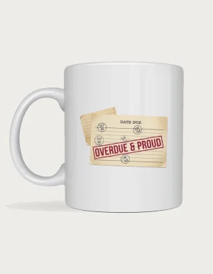 Funny librarian mug with a vintage library due-date card and a red Overdue and Proud rubber stamp, on a white ceramic mug