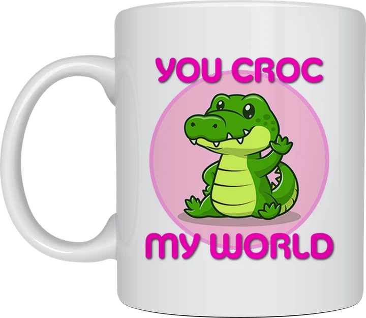 Cute mug - cartoon crocodile waving on a pink circle with the text You Croc My World
