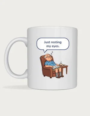 Pop Mug - cartoon grandad asleep in a recliner with a speech bubble saying just resting my eyes, printed on a white ceramic mug