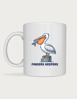 Pelican mug with a cheeky pelican holding a fish in its beak on a jetty post and Finders Keepers lettering on a white ceramic mug