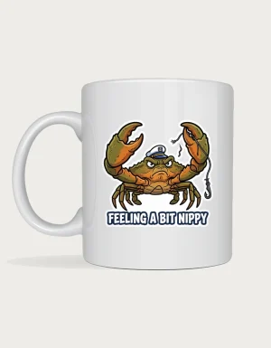 Crab mug with a grumpy mud crab in a captain's hat holding a snapped fishing line and Feeling a Bit Nippy lettering on a white ceramic mug