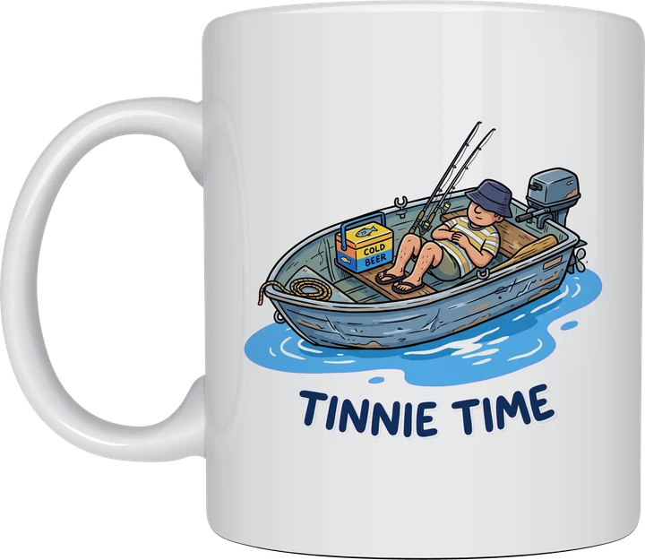 Tinnie Time mug with a cartoon man asleep in a small aluminium boat with an esky and fishing rods on a white ceramic mug