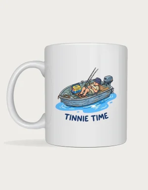 Tinnie Time mug with a cartoon man asleep in a small aluminium boat with an esky and fishing rods on a white ceramic mug