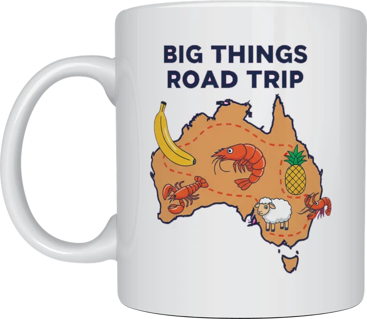 Big things mug: Cartoon map of Australia with giant fruit and animals including a banana, prawns, a pineapple, a sheep and a lobster, titled Big Things Road Trip