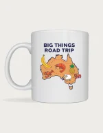 Big things mug: Cartoon map of Australia with giant fruit and animals including a banana, prawns, a pineapple, a sheep and a lobster, titled Big Things Road Trip