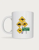 Outback signs mug: Yellow diamond outback road signs showing a kangaroo, wombat, camel and emu, with a green sign reading Next Servo 500 km