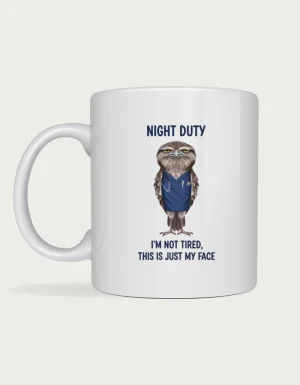 Tawny frogmouth mug with a grumpy frogmouth in navy nurse scrubs and the words Night Duty, I'm not tired, this is just my face
