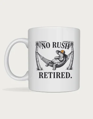 Retirement gift for men mug with a vintage engraving of a tortoise in a sunhat relaxing in a hammock between two palm trees and the words No Rush Retired, on a white ceramic mug