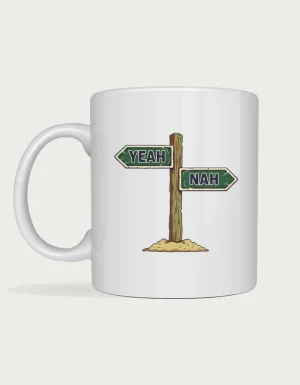 Yeah nah mug: Outback wooden signpost with two green enamel arrows, one reading YEAH and the other NAH, on a mound of dirt